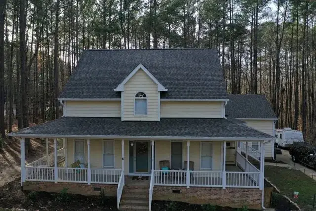 Two-story Triangle home with a new Chief Roofing roof and clean gutter lines